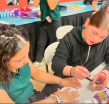 students painting nails